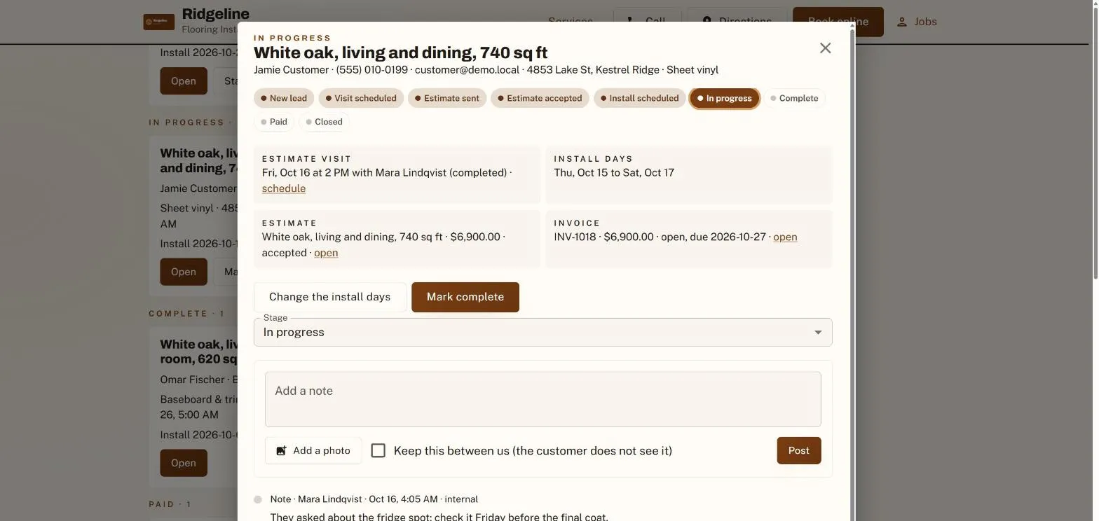 A job dialog over the jobs board: the stage stepper, the linked visit, estimate and invoice, the next-step buttons and the log with a photo